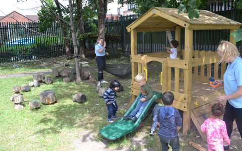 Children enjoying the garden at Happy Kids Heybury Close, Beswick,Manchester Day Nursery