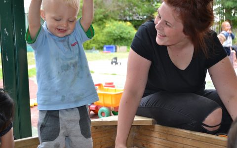 Boy playing in sand at Happy Kids Heybury Close, Day Nursery in Besiwck,Manchester