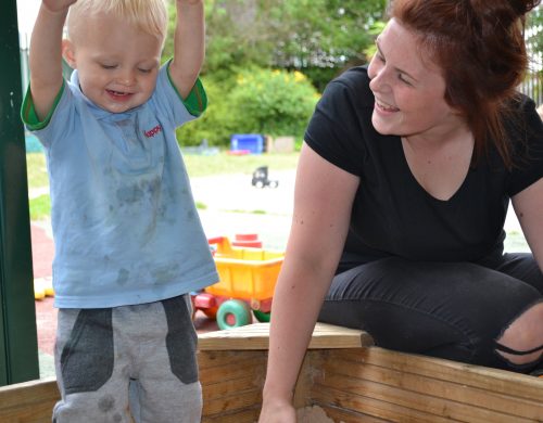 Boy playing in sand at Happy Kids Heybury Close, Day Nursery in Besiwck,Manchester