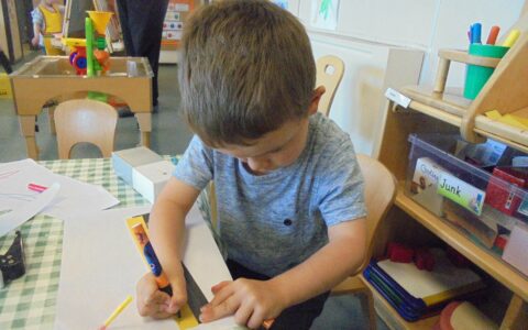 Boy drawing at Happy Kids Thrybergh, Rotherham